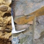 Double colour image of brown rock with circular bumps and field photograph of specimens