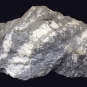 Colour image of gray rock with diagonal white stripes