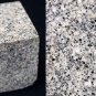 Double colour image of square gray rock block speckled with black, white and gray