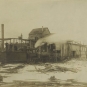 Black and white photograph of wood building with three men and a trail locomotive